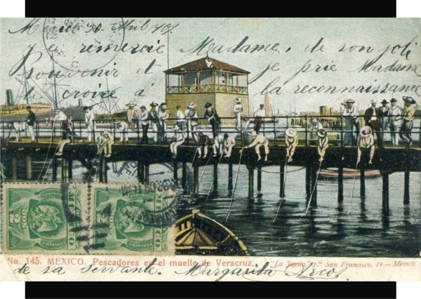 Pescadores en el muelle de la T a principios del siglo XX. Tarjeta postal usada en 1909.